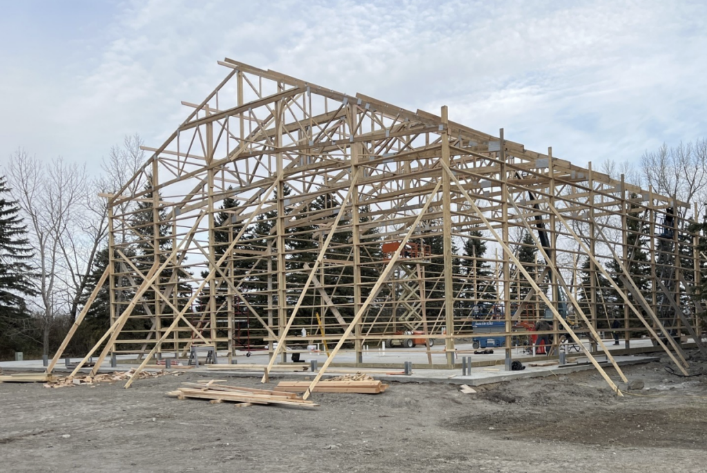 Brooklyn, NY construction crew erecting a stick built barndominium